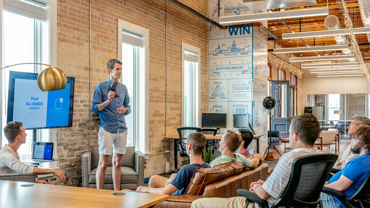 Business professionals reviewing work together in an office